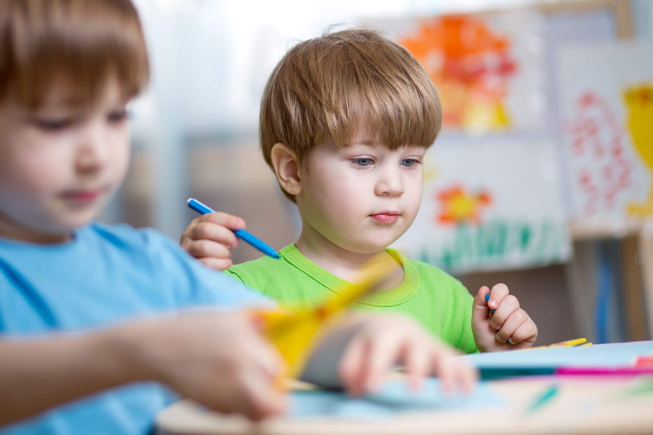 Kids boys painting in nursery at home. Children brothers painting in nursery at home