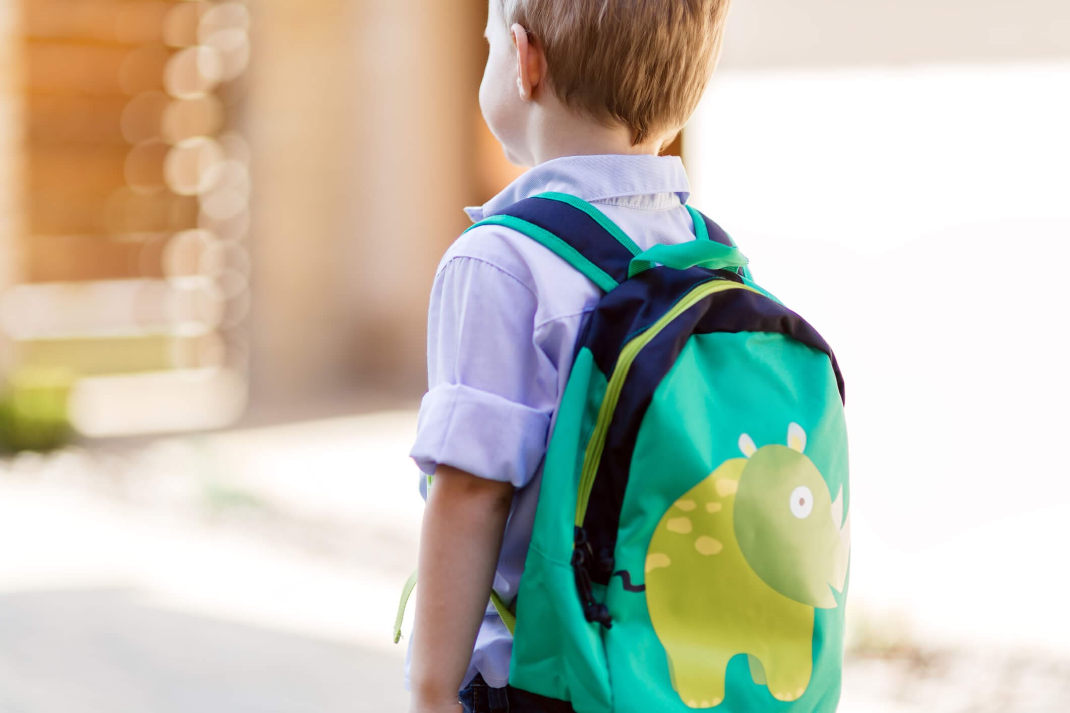 Child leaving home to his first day of kindergarten